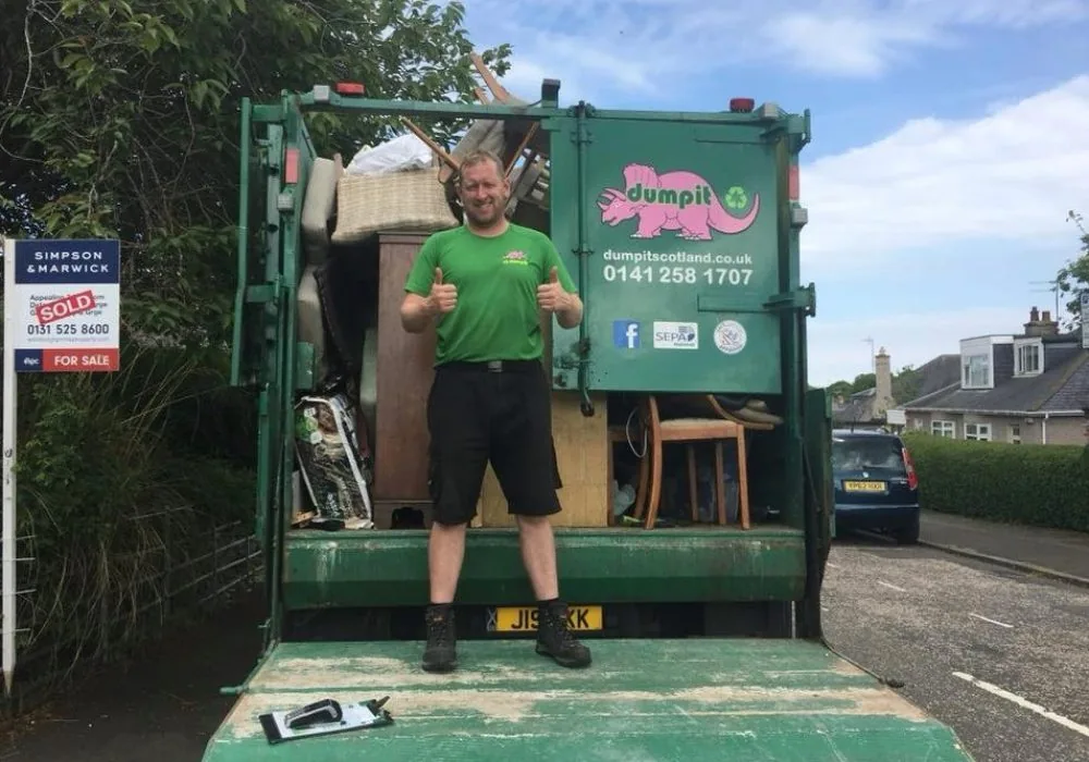 Dumpit crew at the back of a loaded lorry