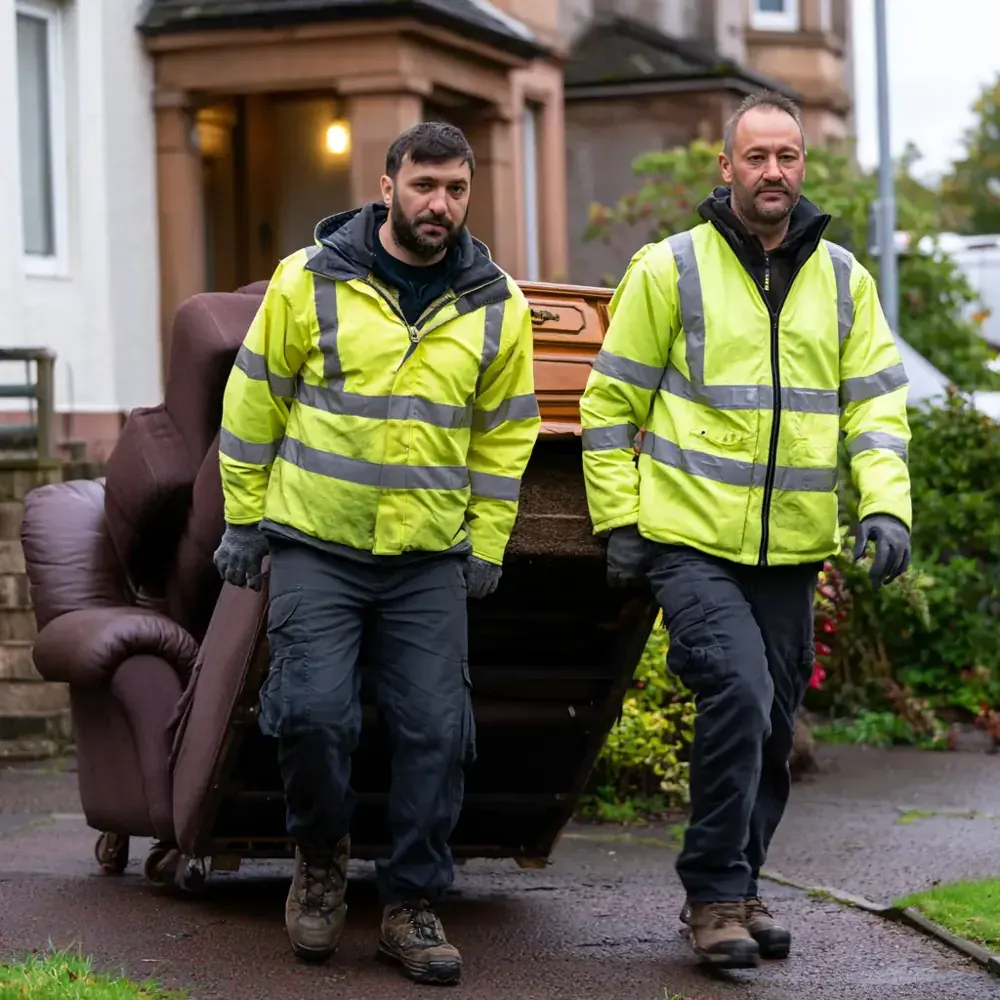Furniture Removal in Alexandria — clearing and carrying items out to the van