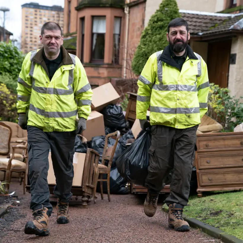 A cleared room after a house clearance in Scotland with waste sorted by stream