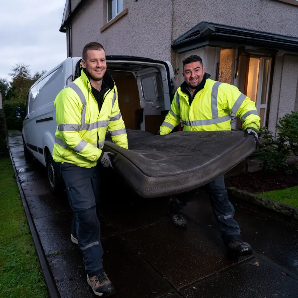 An old mattress being carried out for recycling in Scotland